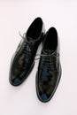 Black glossy men`s classic derby shoes on a white background. Royalty Free Stock Photo
