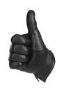 A black glove making the gesture of thumbs up