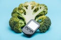 Black glucometer with three broccoli Royalty Free Stock Photo