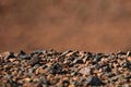 Black Gobi. Stony desert, black stones on the sand. Abstract natural background