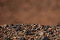 Black Gobi. Stony desert, black stones on the sand. Abstract natural background Royalty Free Stock Photo