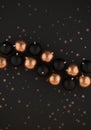 Black and gold christmas balls on dark gray background 3D illustration with copy space Royalty Free Stock Photo