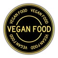 Black and gold round sticker in word vegan food on white background