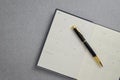 Black and gold fountain pen placed on calendar notebook. Royalty Free Stock Photo