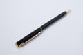 Black and gold pen in a white background Royalty Free Stock Photo