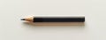 Black and Gold Pencil on White Surface Royalty Free Stock Photo