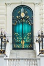 Black and Gold steel classic door in Europe style with white building Royalty Free Stock Photo