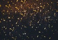 Black and Golden Colored Glitter festive christmas lights background Royalty Free Stock Photo