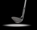 Black Golf Club Wedge Iron Under Spot Light With Black Background