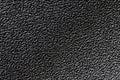 Black grainy plastic surface background Royalty Free Stock Photo