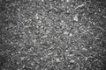 Black Grainy road surface texture. Top view grunge rough asphalt background Royalty Free Stock Photo