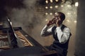 Black grand piano musician on the stage Royalty Free Stock Photo