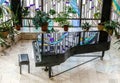 Black grand piano in school hall