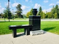 Black granite bench monument with flower vase memorial headstone