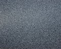 Black granite with gray specks of fine fraction polished surface of natural stone Royalty Free Stock Photo