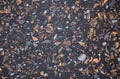 Black granite, polished surface of natural stone with orange and white small inclusions Royalty Free Stock Photo