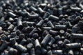 Black granules biochar pellets. Organic biochar derived made from woody material through pyrolysis. Biochar increases the carbon