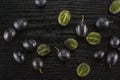 Fresh raw black grape on black wood