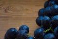 Black Grapes Background On Wood