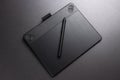 Black graphic tablet and pen. Designer tool for drawing.