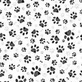 Black gray doodle paw prints and black bones. Seamless fabric design pattern Royalty Free Stock Photo