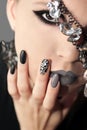 Black gray glam matte makeup and manicure Royalty Free Stock Photo