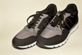 Black-gray sports sneakers ready for training on white background