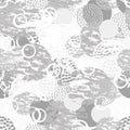 Black, gray and white grunge abstract seamless pattern with circles, rings, different brush strokes and shapes.