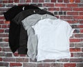 Black, Gray, and White t shirt mockup on brick background