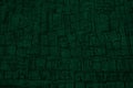 Black green background with space for design. Toned rough surface of an old stone wall. Close-up. Royalty Free Stock Photo