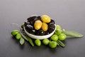 Black and green olives mixed in the porcelain bowl Royalty Free Stock Photo