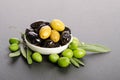 Black and green olives mixed in the porcelain bowl Royalty Free Stock Photo