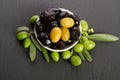 Black and green olives mixed in the porcelain bowl Royalty Free Stock Photo