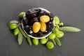 Black and green olives mixed in the porcelain bowl Royalty Free Stock Photo