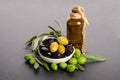 Black and green olives mixed in the porcelain bowl and Virgin olive oil Royalty Free Stock Photo