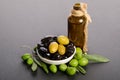 Black and green olives mixed in the porcelain bowl and Virgin olive oil Royalty Free Stock Photo