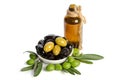 Black and green olives mixed in the porcelain bowl and Virgin olive oil Royalty Free Stock Photo