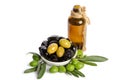 Black and green olives mixed in the porcelain bowl and Virgin olive oil Royalty Free Stock Photo