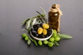 Black and green olives mixed in the porcelain bowl and Virgin olive oil Royalty Free Stock Photo