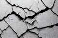 Black and grey cracked rough wall texture with various cracks from long time use. Grunge abstract surface concrete