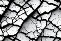 Black and grey cracked rough wall texture with various cracks from long time use. Grunge abstract surface concrete