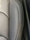 Black grey leather stitched seats in new luxury sports car Royalty Free Stock Photo