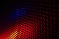 Black grid speaker texture with red and blue colors Royalty Free Stock Photo