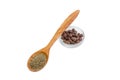 Black ground pepper in wooden spoon and allspice in bowl Royalty Free Stock Photo