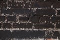 Black grunge background. Black stone background. Old dark gray brick wall. Close-up. Black stone background. Sloppy uneven Royalty Free Stock Photo