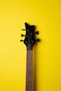 black guitar headstock with five strings centered