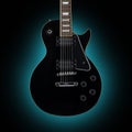 Black guitar isolated on blue background