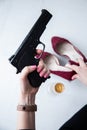 Black gun in the girl`s hand Royalty Free Stock Photo