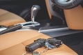 Black gun and handcuff inside the car. For violence on the road Royalty Free Stock Photo