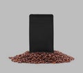 Black gusset packaging mockup on coffee beans, isolated on background, close up Royalty Free Stock Photo